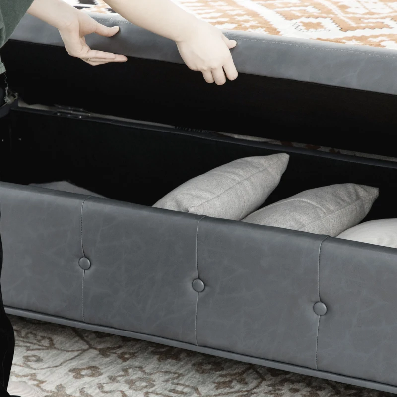 HOMCOM Storage Ottoman Bench with Soft Closing Hinged Lid, Faux Leather Upholstered Bench with Button Tufted Design and Armrests for Living Room, Gray