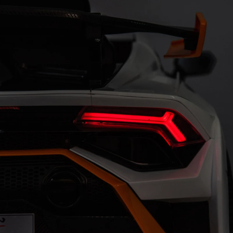 24V Lamborghini Huracan Sto Kids Drift Car with Remote Control, Dual-Drive Suspension, LED Lights, USB, Ages 3-8, 46" L x 27" W x 17" H, White