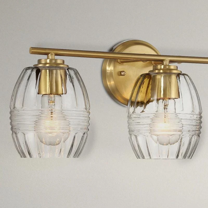 Luxurious Three-Light Vanity Wall Lamp with Clear Glass, Satin Brass Finish, Perfect for Bathroom Decor, 7.5" L x 22" W x 8.5" H, Clear+Gold