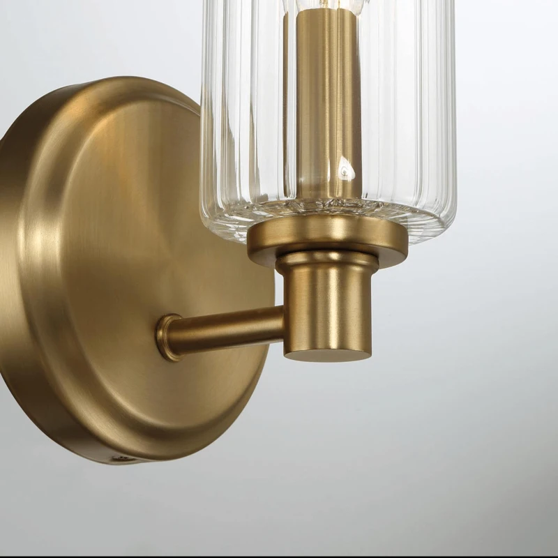 Single Light Wall Sconce with Clear Ribbed Glass, Satin Brass Finish, Elegant Home Lighting Solution, 5" L x 5" W x 10" H, Clear+Gold