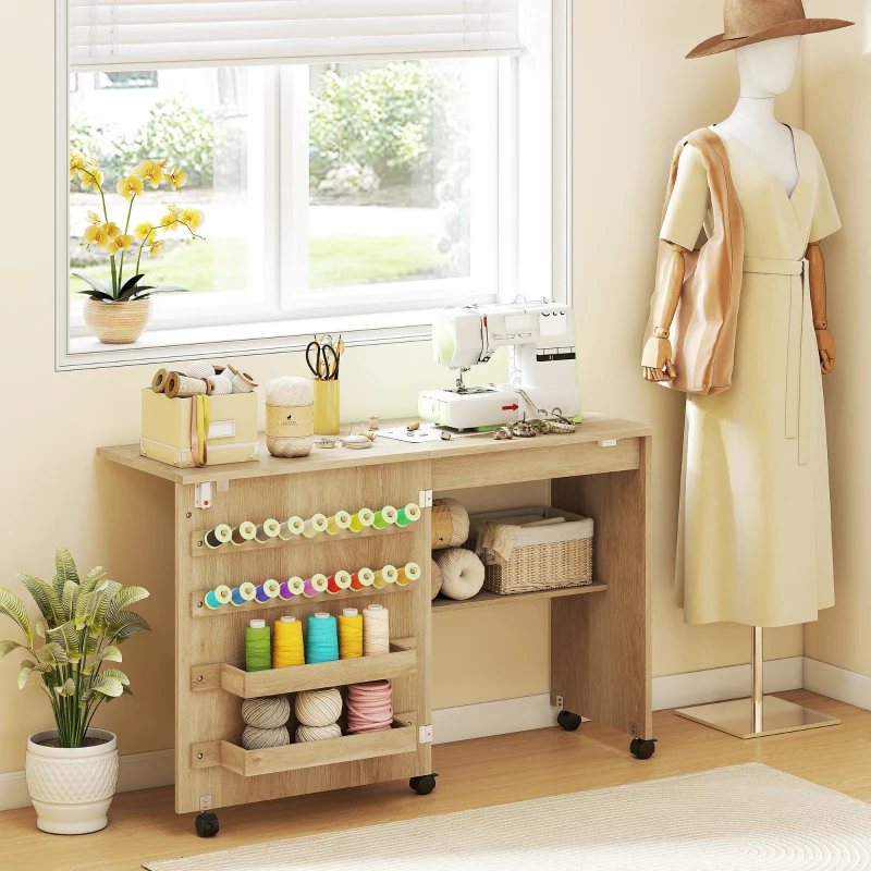 HOMCOM Sewing Machine Table on Wheels, Folding Craft Table with 2 Bins, Storage Shelf, 18 Pegs, Lockable Wheels, Natural