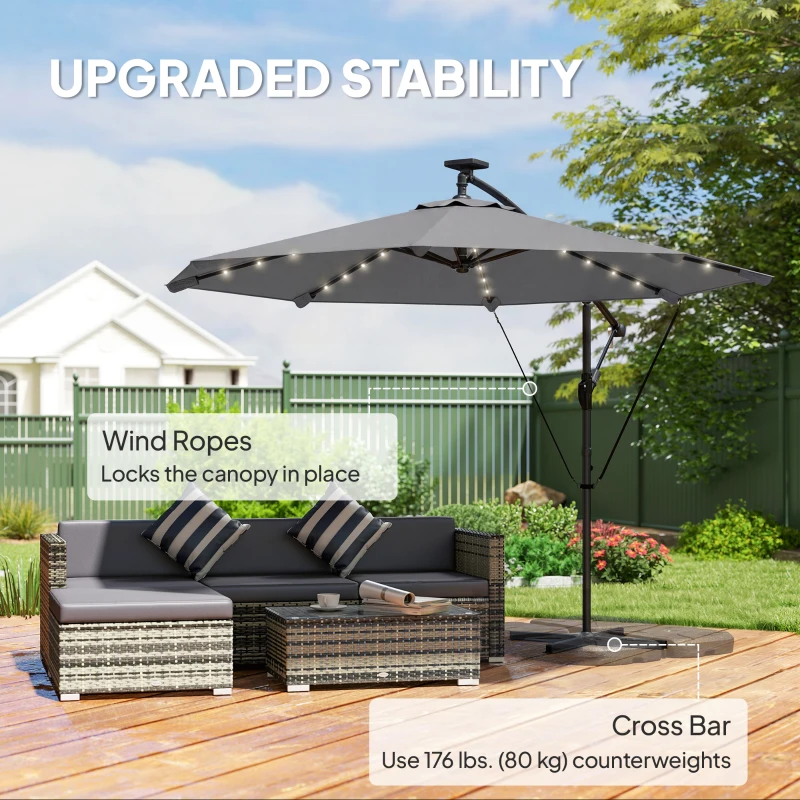 Outsunny 9.7ft Solar LED Cantilever Patio Umbrella with 32 LED Lights, Cross Base, Crank Handle, for Poolside, Deck, Dark Grey
