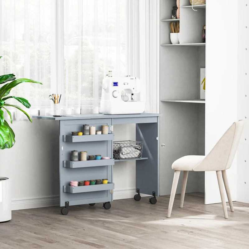 HOMCOM Folding Sewing Table, Rolling Utility Work Station Side Desk with 3-Tier Storage Bins, Shelf, and Lockable Casters, Grey