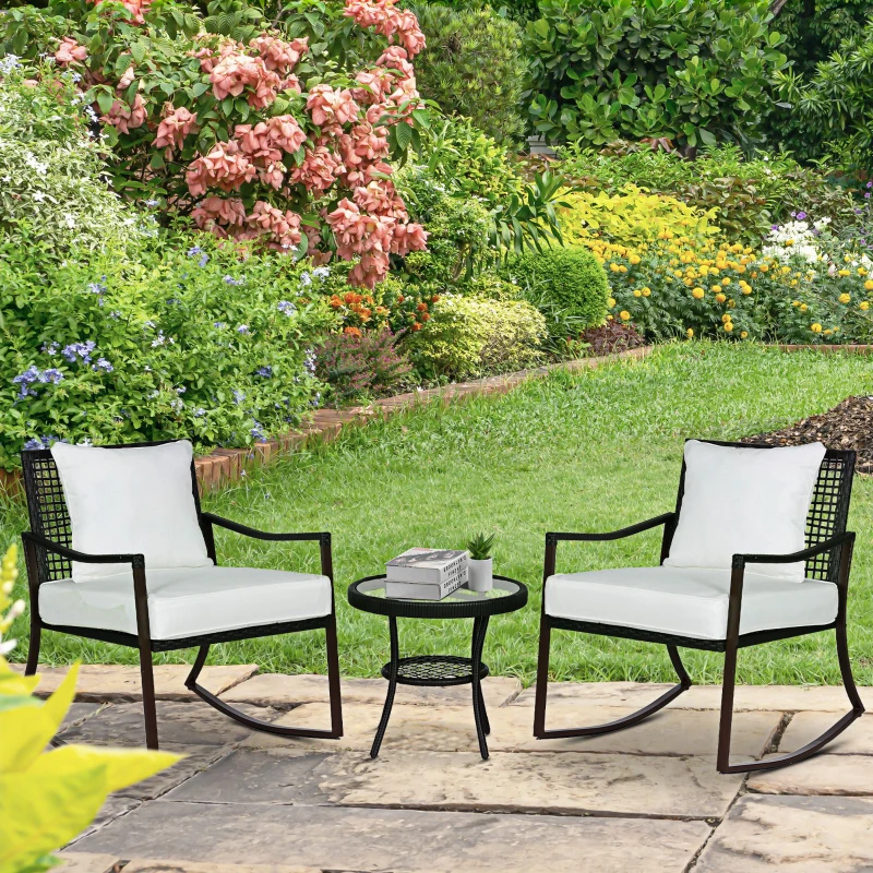 Outsunny 3 Piece Patio Rocking Bistro Set, Outdoor PE Rattan Wicker Rocking Chairs with Cushioned, Pillows, Two-Tier Glass Storage Shelf Coffee Table, Cream White