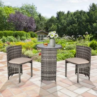 Outsunny 3 PCS Outdoor Rattan Wicker Bistro Set with Storage Shelf, Glass Top Table, Soft Cushioned Chairs and Space Saving Design, Patio Conversation Set for Garden Backyard Porch, Grey(m-2)