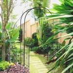 Outsunny 84.75" x 19" Metal Garden Arch with Gate Climbing Planter Frame Backyard Decor for Vines Morning Glory Black(c-1)