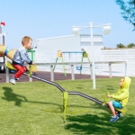 HOMCOM Kids Spinning Seesaw Swivel Teeter Totter Playground Equipment 360° Rotation Child Seesaw Rocker Swing Green & Grey